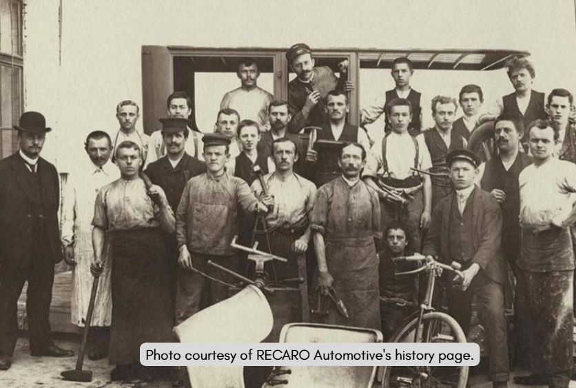 Vintage photograph of a group of people with bicycles, photo courtesy of RECARO Automotive.